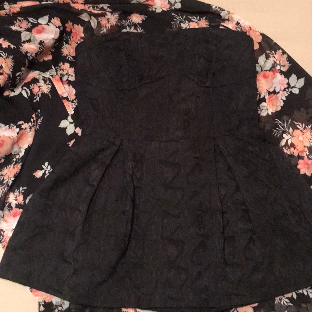 Black, strapless bodice-flare at empire waist.